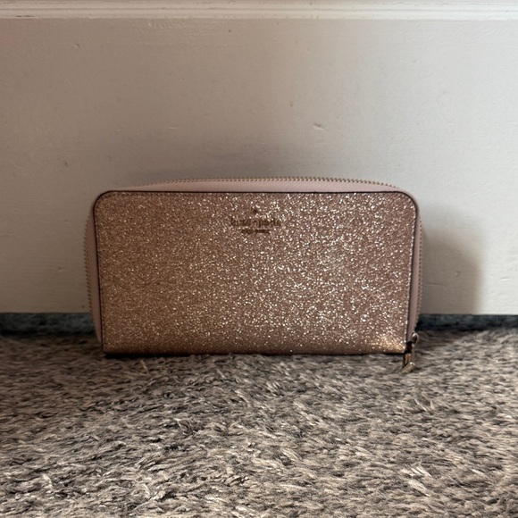 kate spade Handbags - Like New:Kate Spade Gold Glitter Zip Wallet